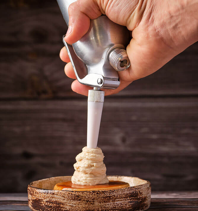 Professional MonsterWhip cream charger in use