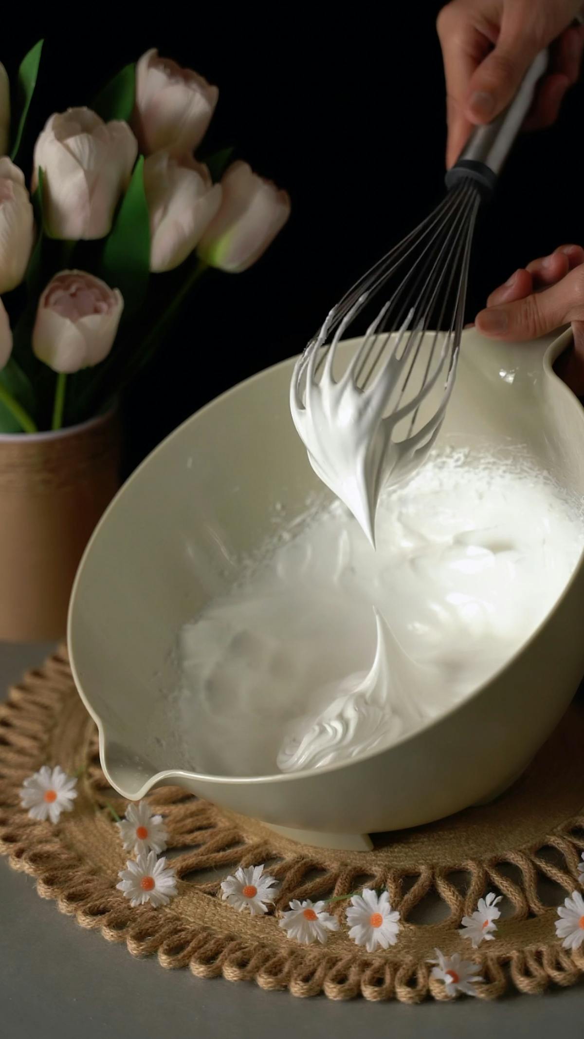 Close-up of chef preparing whipped cream using professional equipment