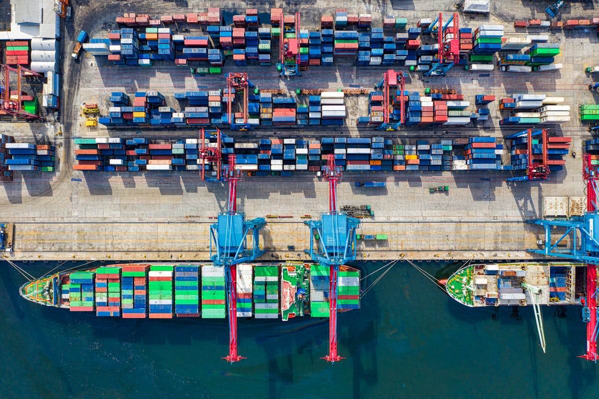 Shipping containers at port - wholesale cream charger international logistics
